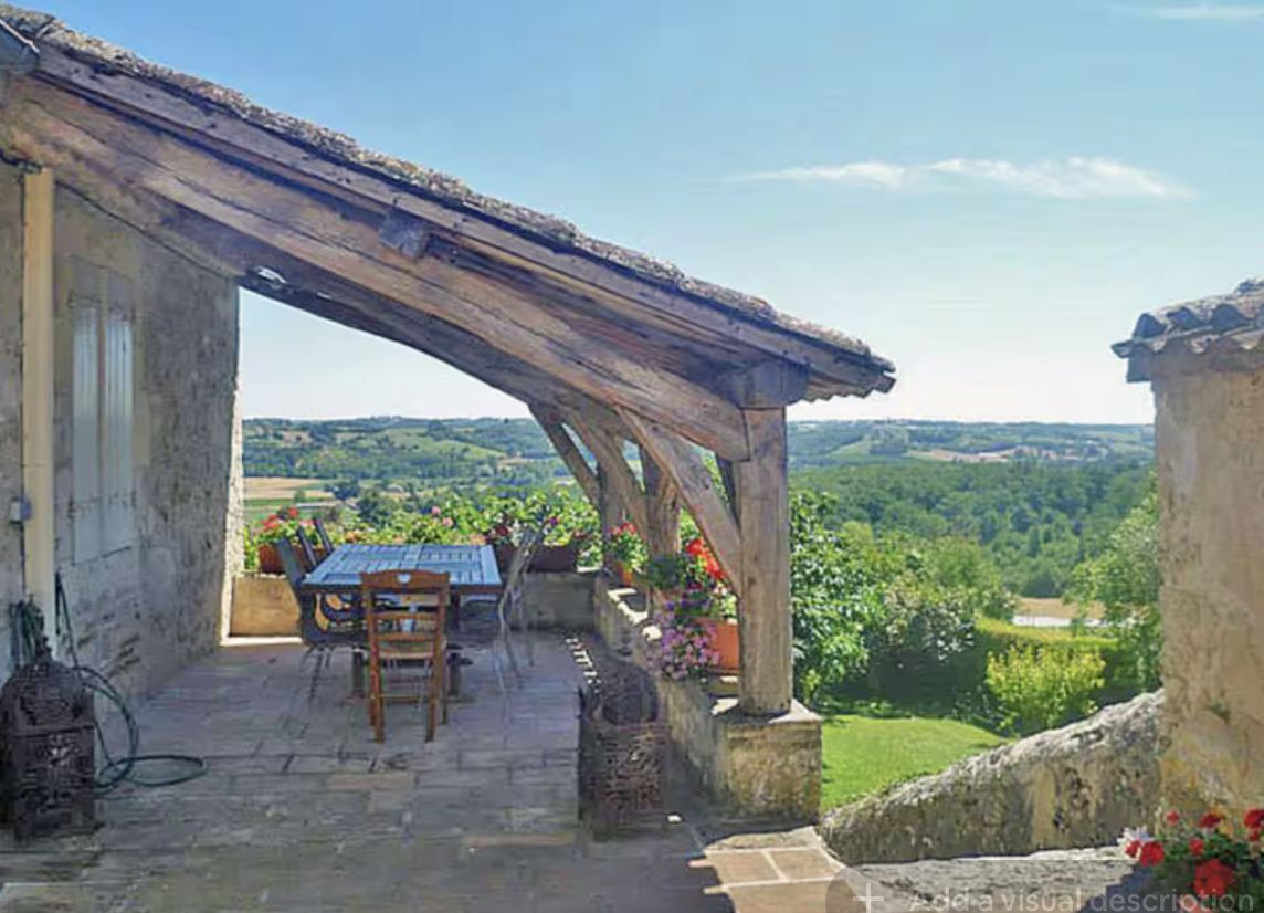 Covered outside dining terrace at Mongaudon overlooking the valley