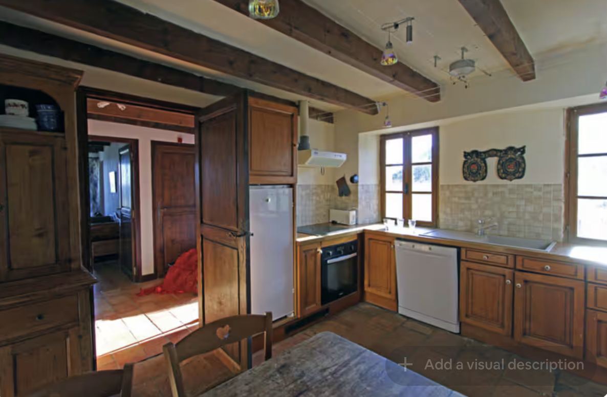 Kitchen dresser and stairwell at Mongaudon